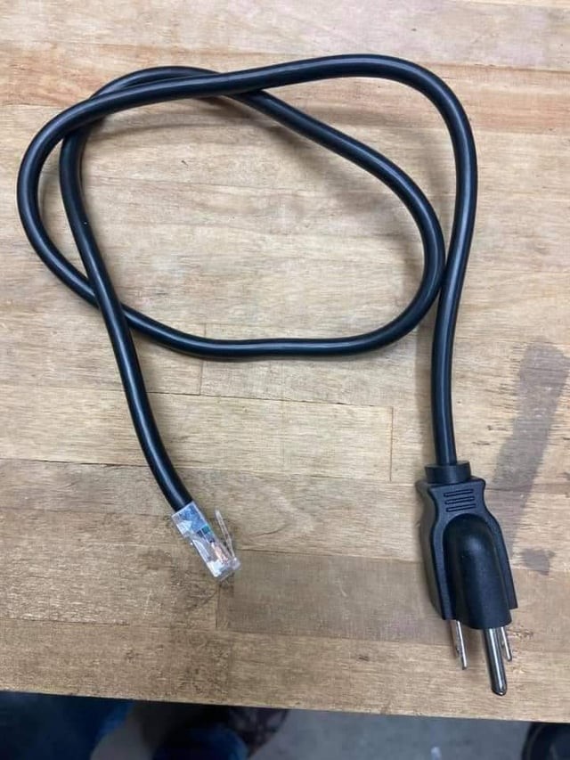 An Ethernet cable to three prong electrical plug